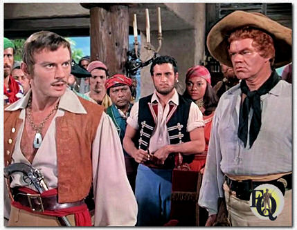Louisiana buccaneer Jean Lafitte (Yul Brynner) as seen in "The Buccaneer" (Paramount, Dec 1. 1958) with George Mathews (R) as Pyke.