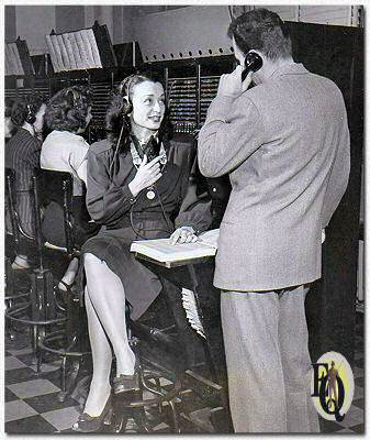 Charlotte Keane as Nikki Porter shown with the master sleuth as they put in a long-distance call to the night's guest armchair detective. Beginning Nov. 20. 1946, they will reach out all over the United States, by long distance phone, to call on listeners for their solutions.